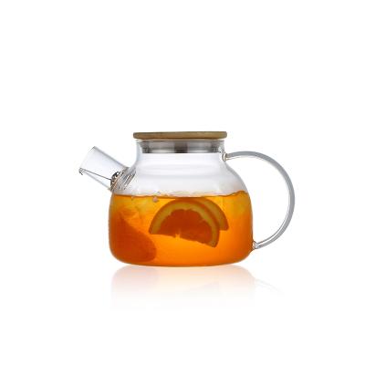 China Viable Chinese Supplier Glass Teapot Warmer Pour In Bamboo Lid Moroccan Glass Teapot for sale