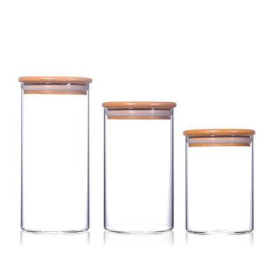 China Viable Airtight Lid 500ml Glass Food Storage Bamboo Jar For Honey Candy Cookie Clear Glass Jar for sale