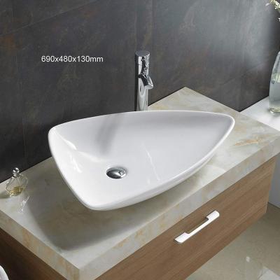 China Irregular Shape Luxury White Ceramic Vessel Sink Above Counter Bathroom Wash Basin for sale