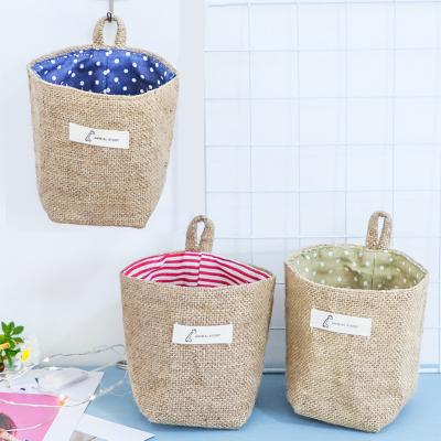 China Sustainable Collapsible Burlap Storage Basket Bin Double Sided Desktop Storage Bag Hanging Jute Storage Basket for sale