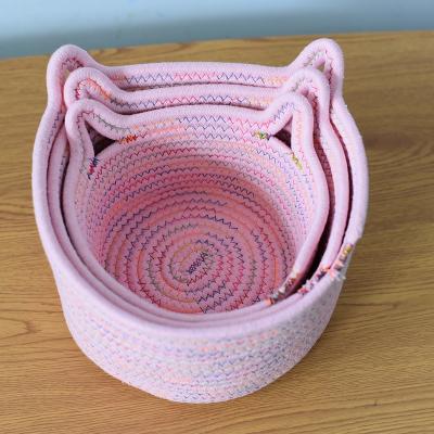 China Sustainable Factory Price Customized Hand Woven Rattan Pink Natural Round Cotton Rope Storage Baskets for sale