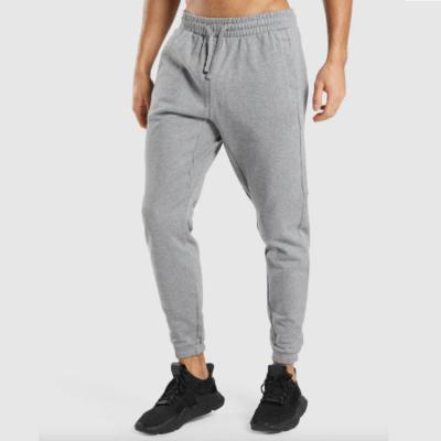 China Anti-Wrinkle Mens Fitness Sportswear Tracksuit Bottoms Skinny Sweatpants Pants Gyms Tracksuit Track Pants Men's Tracksuits for sale