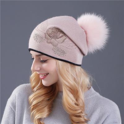 China Dobby Adults Class Beanie Hat Wholesale Fashion Women Woolen Warm Beanie Hat With Raccoon Fur Pompom for sale