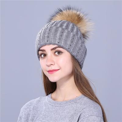 China Wholesale Custom Logo Man and Women Dobby Adult Winter Unisex Knitted Hat Fur Pom Pom Knit Beanie for sale