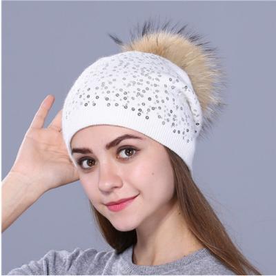 China Dobby Women's Beanies With Raccoon Fur Pompom Autumn Winter Caps Female Angora Natural Fashion Hats for sale