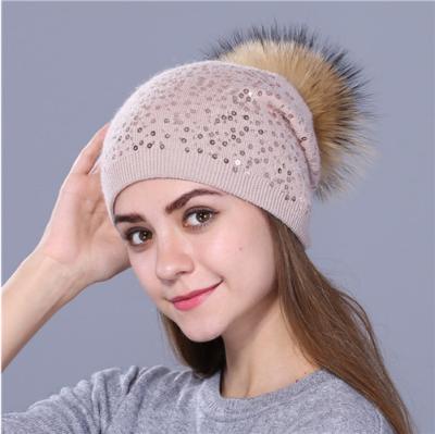 China Big Warm Dobby Fur Pom Pom Hat Winter Knit Hats Fashion Angora Knitted Beanie Hat With Raccoon Fur Pompoms for sale