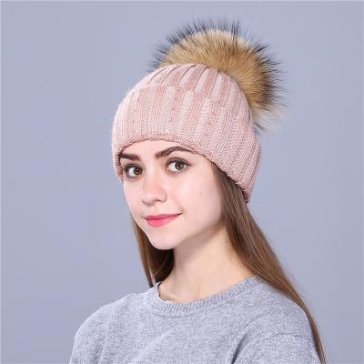 China New dobby products design hat factory price raccoon fur pompom knitted angora fur hat for adults and kids for sale