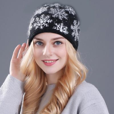 China Natural Dobby Winter Fur Pompom Knitted Hats For Women Fashion Wide Cuff Cashmere Beanies Custom Made for sale