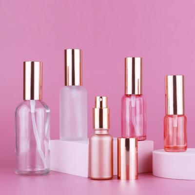 China Custom Cosmetic Packaging 5ml 10ml 15ml 20ml 30ml 50ml 100ml Mist Round Thin Shoulder Frosted Rose Gold Glass Perfume Bottle for sale