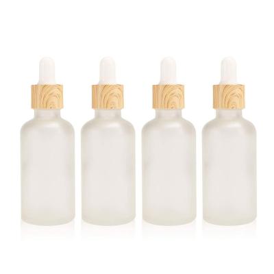 China Cosmetic Frosted Glass Dropper Bottle Essential Oil Bottles With Eye Dropper Lids Perfume Sample Vials Essence Liquid Cosmetic Containers for sale