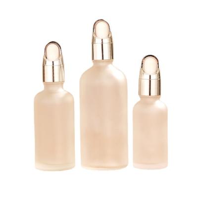 China Personal Care Wholesale Essential Oil Bottle White Frosted Dropper Filled Glass Empty Bottle for sale