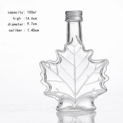 China New Style 100ml Maple Leaf Wine Bottle Luxury High End Empty Wine Bottle for sale