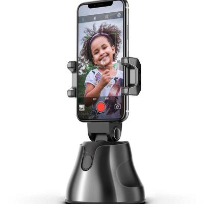 China PORTABLE Free Shipping 1 Sample OK 360 Auto Rotate Face Object Selfie Tracking Stick Smartphone Shooting Camera Cell Phone Holders for sale