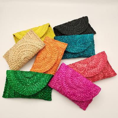 China Straw Woven Women's Handbags High Quality Straw Woven Women's Handmade Straw Clutch Beach Ladies Wallets for sale