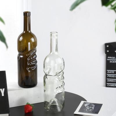 China Hand Model Food Grade High Capacity Long Neck Creative Design Wine Bottles 750ml Transparent Glass Bottle for sale