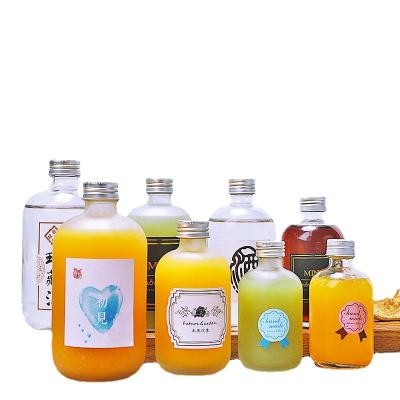 China Wholesale Food Grade 100ml 200ml Frosted Clear Flat Flask Spirit Pocket Juice Glass Bottles For Soft Drink for sale