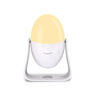 China Creative Portable Projection Patterns Warm White Light Children's LED Touch Tapping Night Light Egg Lamp in Running Color-Changing Brightness for sale