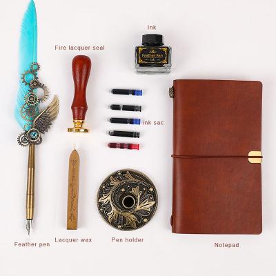 China Eco-Friendly Feather Pen Retro Calligraphy Pen Set With Seal Stationery Gift Box Pen Feather Notebook Fire Paint Ink Squeeze Tube Ink Bag for sale