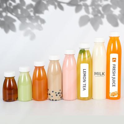 China Juice Drink Customized 500ml Round Pet Juice Bottle 250ml 8oz 350ml Fruit Beverage Bottle Packing Milk Tea Plastic Orange Bottle for sale