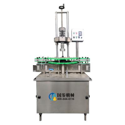 China Automatic Electronic Plastic Food Wine Glass Bottle Aluminum Foil Ropp Cap Sealing Machine for sale