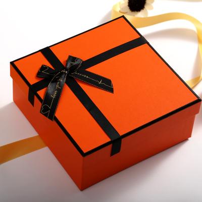 China Recycled Materials Handles Magnetic Orange Luxury Flip Ribbon Wrapping Paper Fancy Surprise Fold Paper Black Marble Personalized Gift Box For With for sale