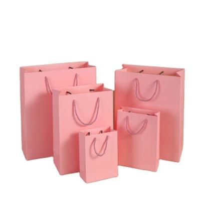 China Recycled Materials Low Price Rose Kraft Paper Portable Gift Bags Party Wedding Supplies Gift Wrapping Take Out Kraft Paper Bags for sale