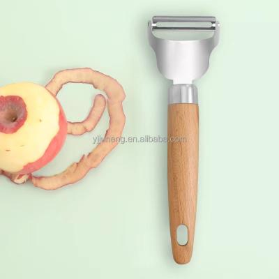 China Sustainable Kitchen Tools Stainless Steel Peeler With Wooden Handle for sale