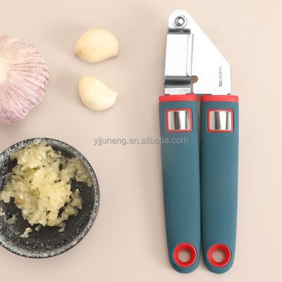 China Sustainable Kitchen Instruments Stainless Steel Garlic Press With Silicone Handle for sale