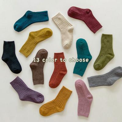 China Kids Children's Socks Wholesale 2021 Autumn And Winter Solid Color Half Fleece Baby Socks Thickened Warmth For Men And Women Kids for sale