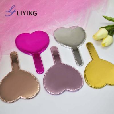 China Personalized PU Heart Shape Shiny Leather Hand Mirror Personalized LOGO Printing Cosmetic Makeup Mirrors Custom Made for sale