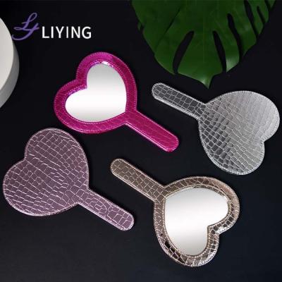 China Custom Made Cosmetic Mirror Sellers Belle PU Heart Mirror Hand Held Private Label Wholesale Pink Leather Mirror for sale