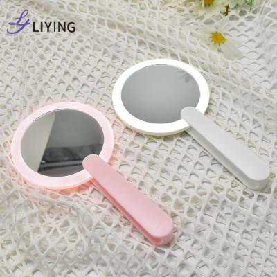 China New Design Lighted Around Travel Handheld Mirror Portable Small Mirror LED Makeup Mirror for sale