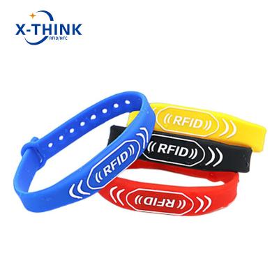 China Factory price payment moneyless silicone rfid waterproof nfc wristband/waterproof wristbands 213/215 nfc band for sale