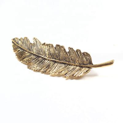 China Hair clip/elegant feather hair clip metal hair clip gold hair accessories factory accessory for sale