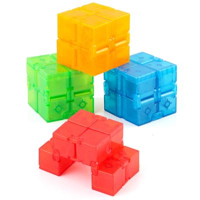 China Flip Magic Cube Mini Plastic Flip Magic Cube Stress Reliever Finger Cube Magic Toy Fiddly Person Infinite Finger for sale