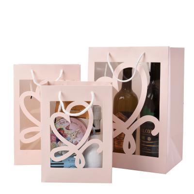 China Custom Creative Colorful Paper handle Gift Bag Packaging With Transparent Window for sale