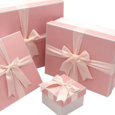 China Spot Color Luxury Pink Rigid Cardboard Gift Box Handbags Cosmetic Gift Packaging Box with Ribbon for sale