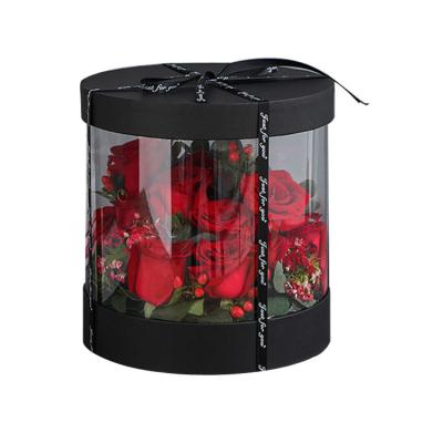 China Luxoso conjunto de regalos de flores de rosa con cajas redondas de terciopelo personalizables y de cartón rígido sostenible en venta