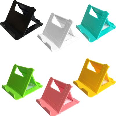 China Wholesale Adjustable Multi-angle Universal Foldable Pocket Stand Tablet Holder Desktop Cradle For Tablets Mobile Phone Stand for sale