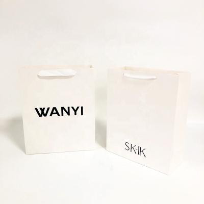 China Recycled Materials Hot Sale White Art Paper Bag Custom Your Own Logo Print Shoes Clothing Paper Bag With Drawstring Handles for sale