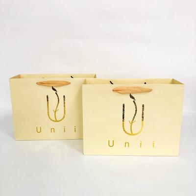 China Recycled Materials Hot Sale Art Paper Bag Custom Your Own Logo Print Shoes Clothing Paper Bag With Ribbon Handles for sale