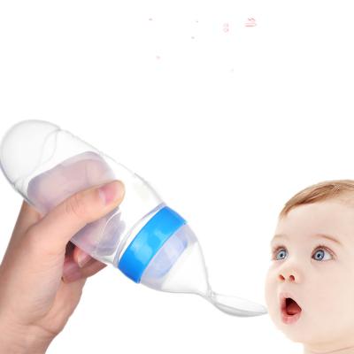 China Amazon BPA Free Hot Sale Silicone Feeding Bottle with Spoon for Hands Free Infant Baby Kids Feeding Bottle for sale