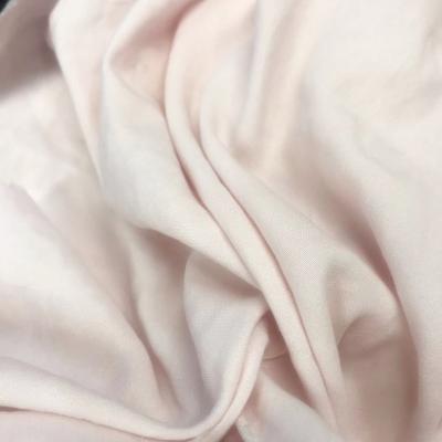 China Softer handfeeling stonewashed waterproof pink color 100 cotton soild polyester microfiber fabric for bed linen for sale