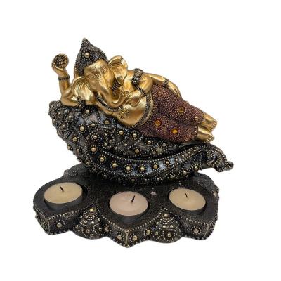 China 2021 Artificial Fashionable Modern Design Polyresin Ganesh Lying On Decorative Shell Tealight Stand Figurine for sale