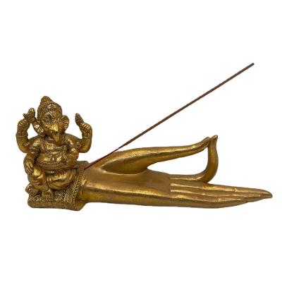 China 2021 New Decorative Stitch Polyresin Golden Ganesh Hand Artificial Incense Holder for sale