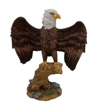 China Artificial made in China polyresin wing-out eagle on trunk figurine statue for sale