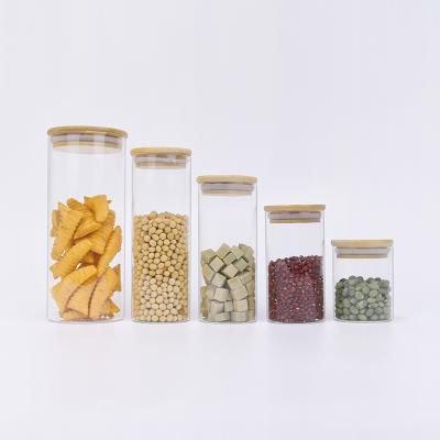 China Multifunctional Food Round Glass Jars 250ml 350ml 550ml Clear Borosilicate Cookie Honey Nuts Glass Storage Jar With Bamboo Wooden Lid for sale