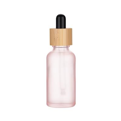 China Multifunctional Frosted Rose Essential Oil Bottle 5ml 10ml 30ml 50ml 100ml With Bamboo Cap for sale