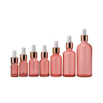 China Wholesale Custom Multifunctional 5ml 5ml 10ml 15ml 20ml 30ml 50ml 100ml Essential Oil Dropper Cosmetic Pastel Transparent Glass Pink Bottles for sale