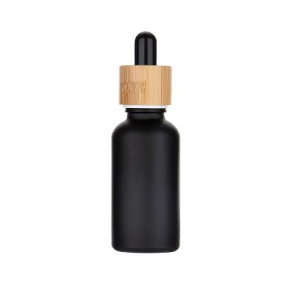 China Free Samples 5ml 10ml 15ml 20ml 30ml 50ml 100ml Multifunction Matte Black White Essential Oil Serum Glass Dropper Bottle With Bamboo Lid for sale